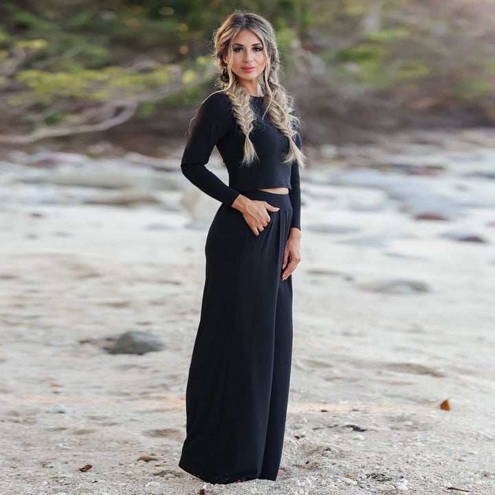 Kvinnor Elegant Jumpsuit med Vid Ben och Långa Ärmar Mirla-Eva Jonsson
