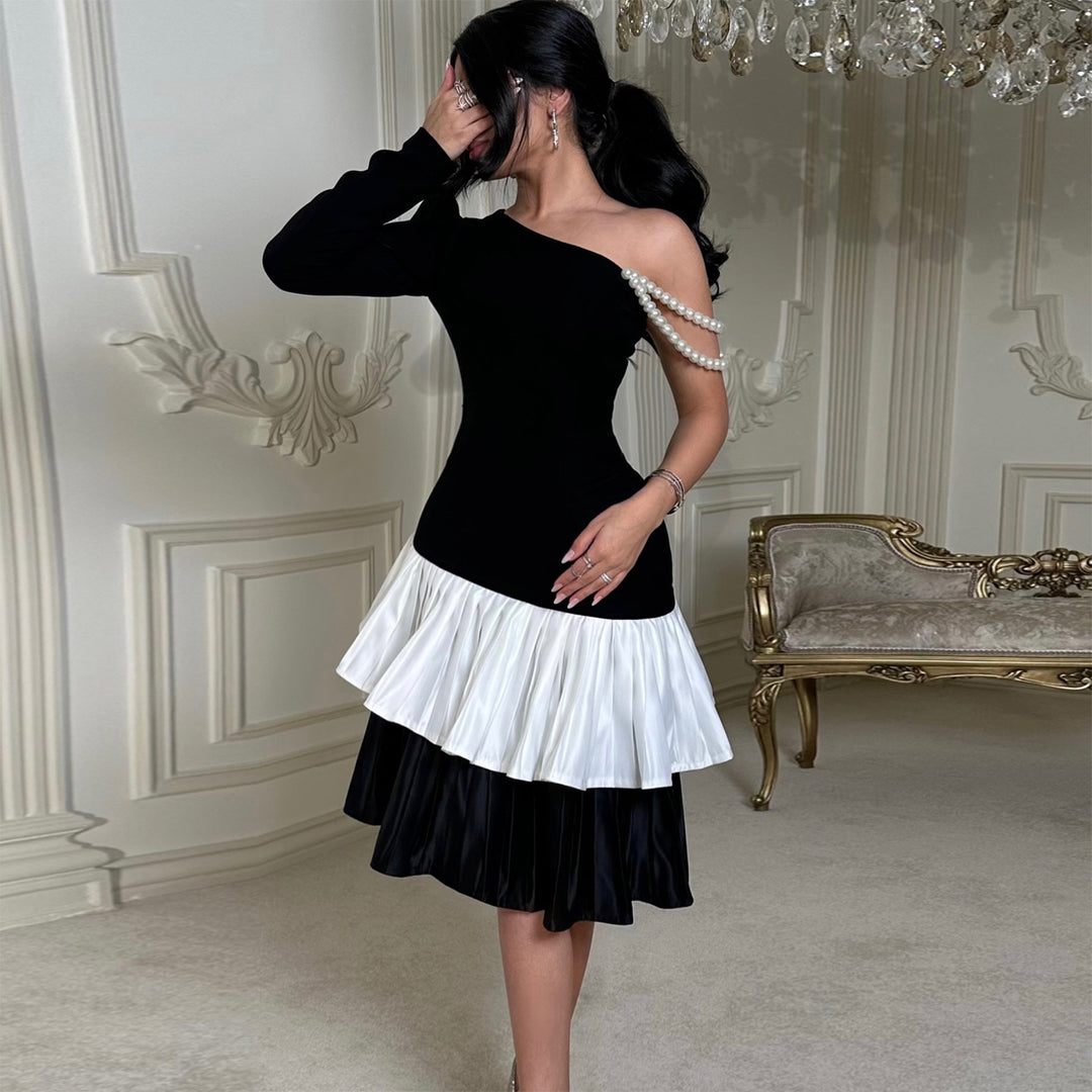 Kvinnor Elegant Klänning med Asymmetrisk Skärning och Volangdetaljer-Eva Jonsson