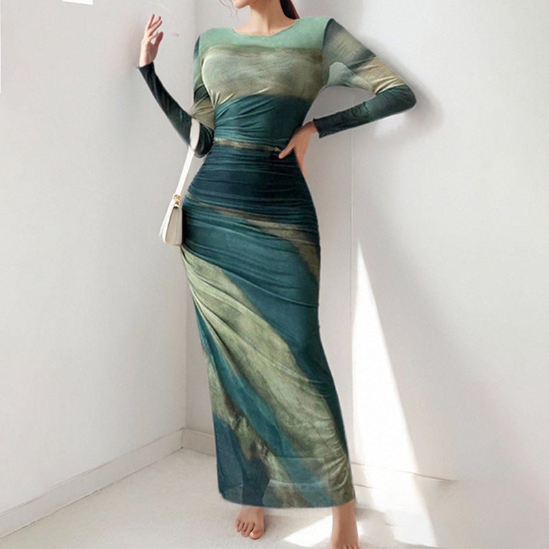 Kvinnor Elegant Maxi Klänning med Fina Draperingseffekter och Lång Ärmar Mirla-Eva Jonsson
