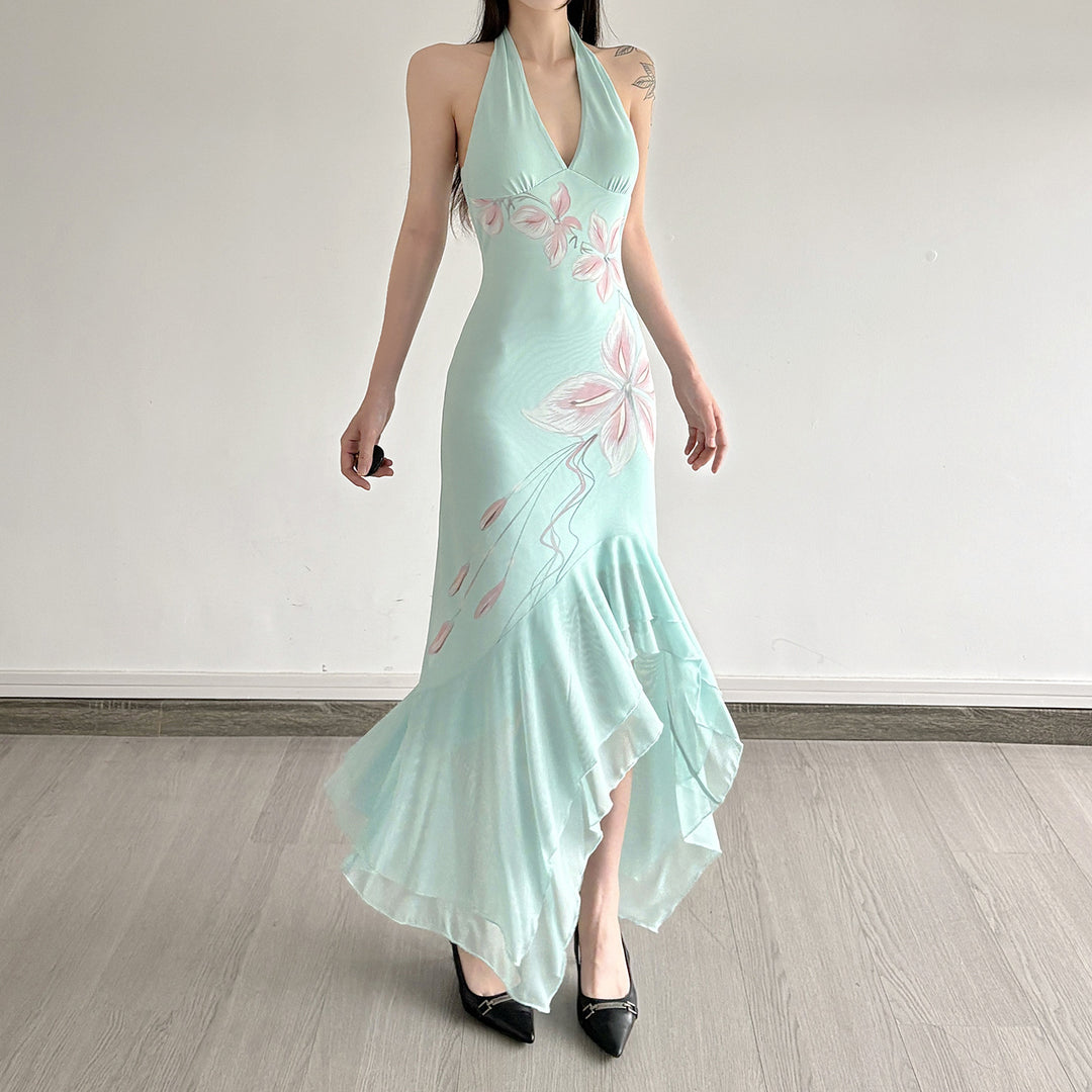Kvinnor Elegant Maxiklänning med blommigt mönster och asymmetrisk fåll Mirla-Eva Jonsson