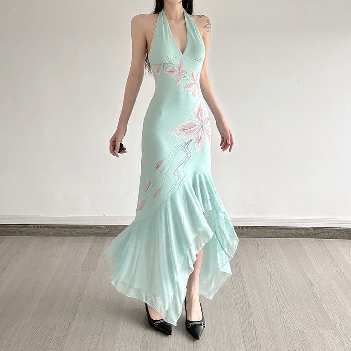 Kvinnor Elegant Maxiklänning med blommigt mönster och asymmetrisk fåll Mirla-Eva Jonsson