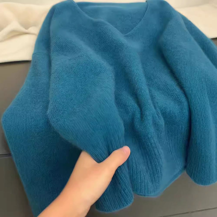Kvinnor Elegant V-Hals Tröja med Ribbad Struktur och Avslappnad Snitt Mirla-Eva Jonsson