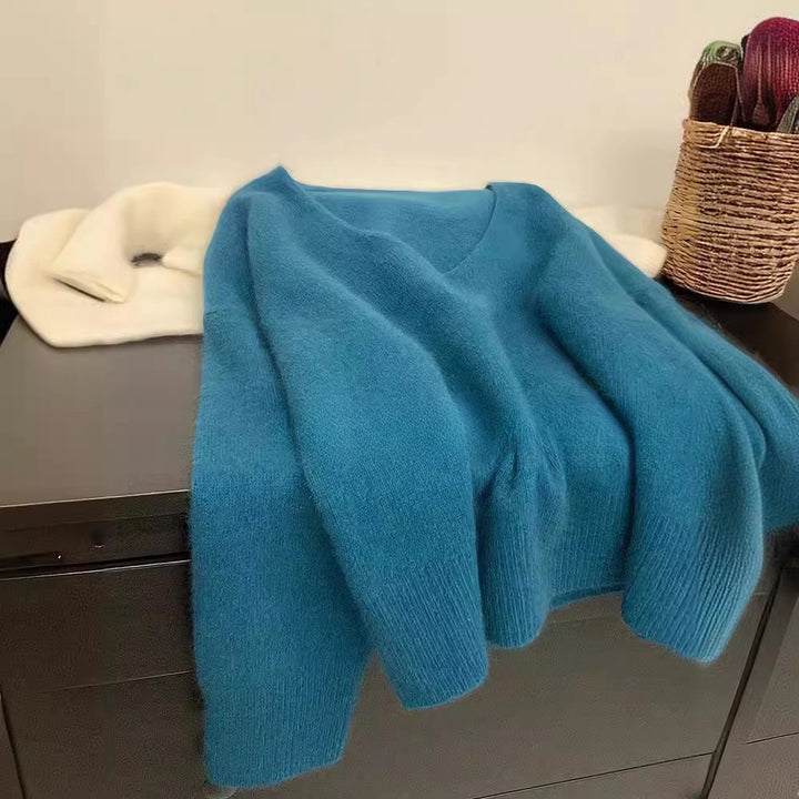 Kvinnor Elegant V-Hals Tröja med Ribbad Struktur och Avslappnad Snitt Mirla-Eva Jonsson