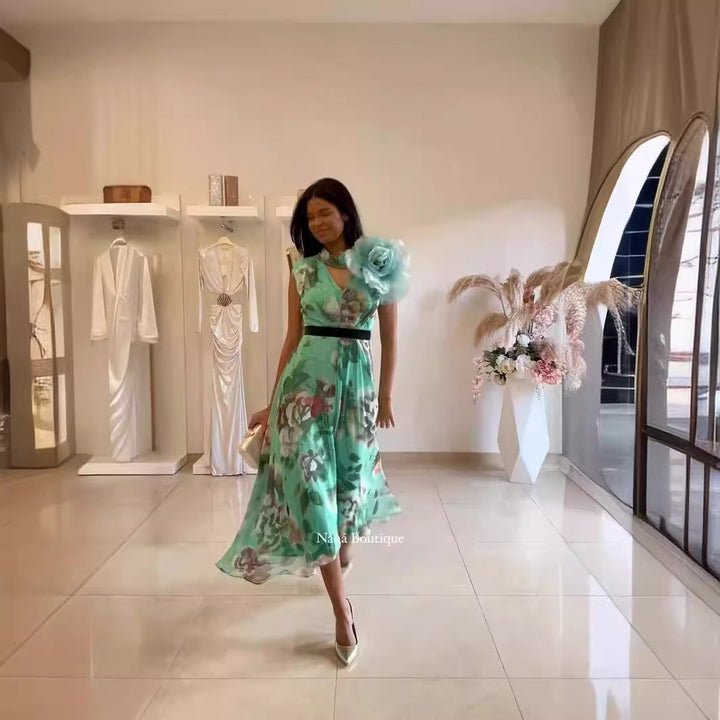 Kvinnor Fladdrande Maxi Klänning med Blommönster och Off-Shoulder Volang Mirla-Eva Jonsson