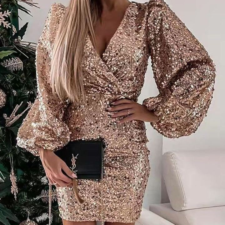 Kvinnor Glittrande Miniklänning med Ballongsärmar och Inlindad Utseende-Eva Jonsson