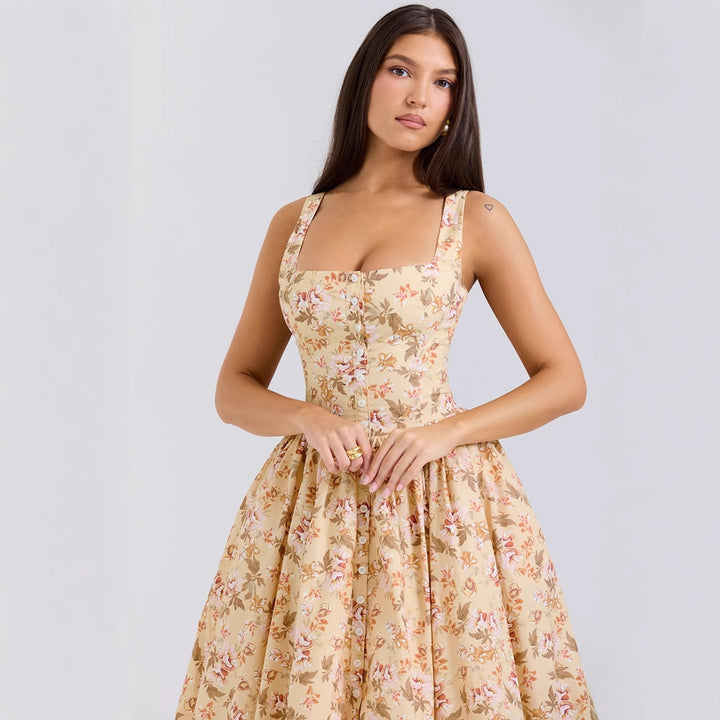 Kvinnor Midi Klänning med Elegant Blommönster och Smygremmar Mirla-Eva Jonsson