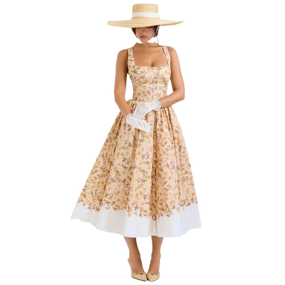 Kvinnor Midi Klänning med Elegant Blommönster och Smygremmar Mirla-Eva Jonsson