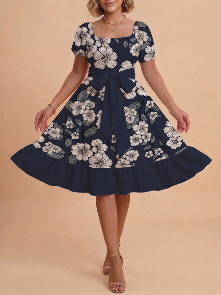 Kvinnor Midi Klänning med elegant blommönster och figursyddt bälte Mirla-Eva Jonsson
