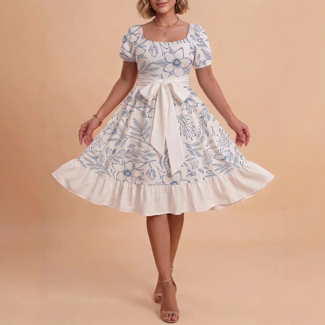 Kvinnor Midi Klänning med elegant blommönster och figursyddt bälte Mirla-Eva Jonsson