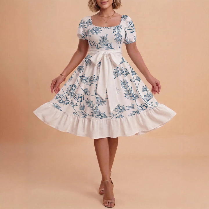 Kvinnor Midi Klänning med elegant blommönster och figursyddt bälte Mirla-Eva Jonsson