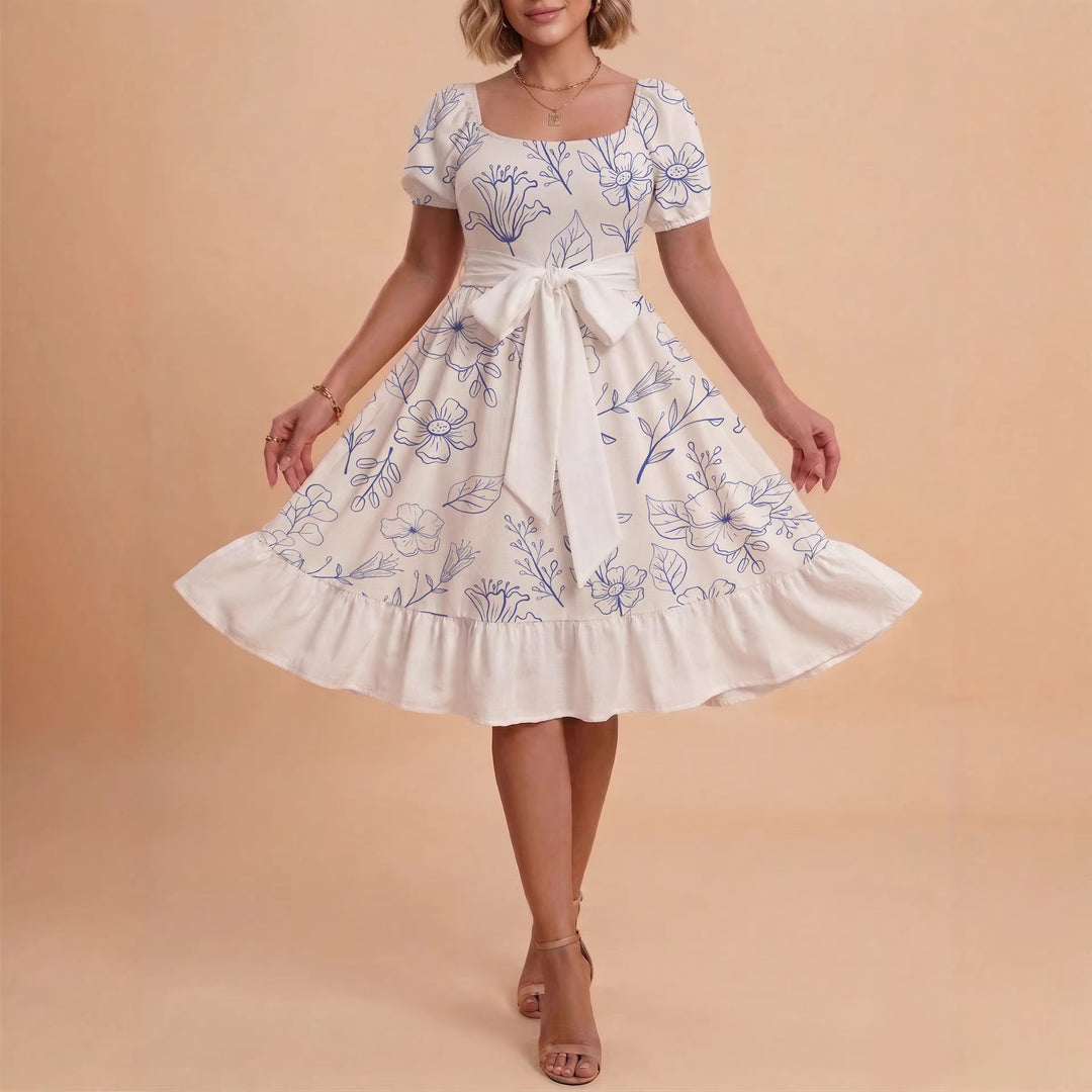 Kvinnor Midi Klänning med elegant blommönster och figursyddt bälte Mirla-Eva Jonsson