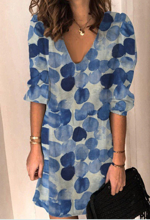 Kvinnor Miniklänning med elegant V-ringning och voluminösa puffärmar Mirla-Eva Jonsson