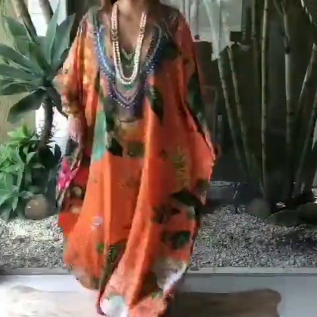 Kvinnor Strandkaftan med Konstnärligt Blommönster och Dekorativ Pärlprydnad Mirla-Eva Jonsson