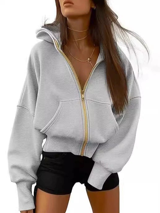 Kvinnor avslappnad hoodie med voluminösa ärmar och guldfärgad dragkedja Eva Jonsson-Eva Jonsson