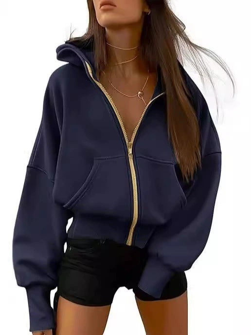 Kvinnor avslappnad hoodie med voluminösa ärmar och guldfärgad dragkedja Eva Jonsson-Eva Jonsson