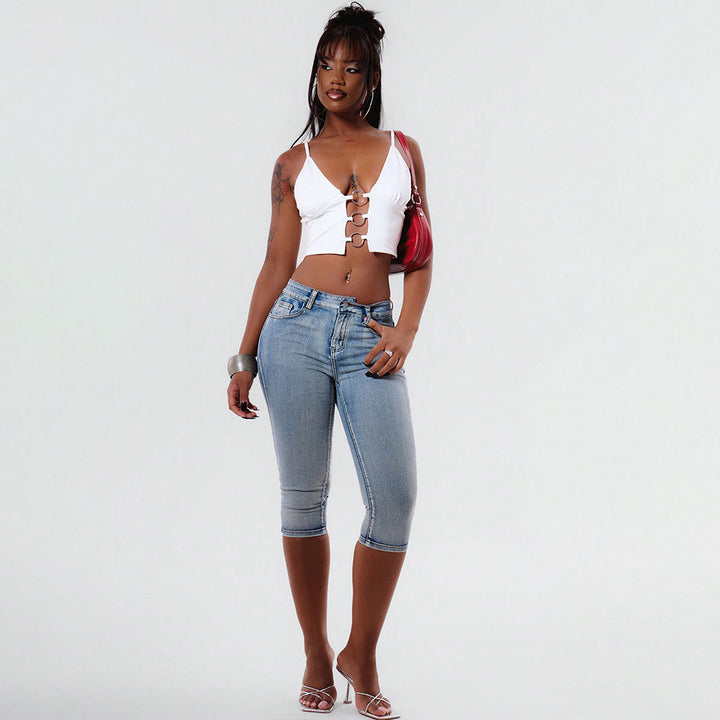Kvinnor cropped top med dekorativa spännen och v-form-Eva Jonsson