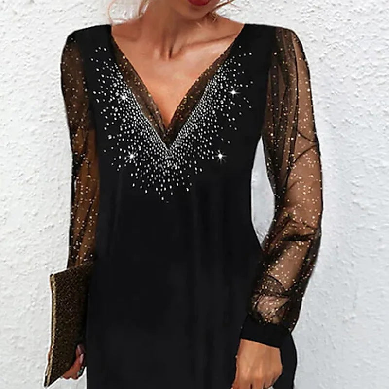 Kvinnor elegant aftonklänning med glittrande accenter och genomskinliga ärmar Eva Jonsson-Eva Jonsson