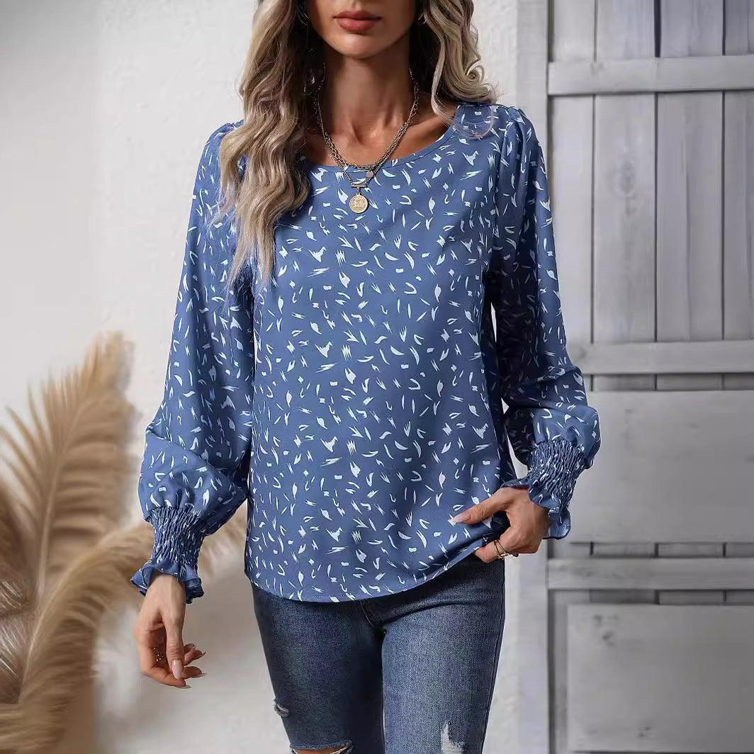 Kvinnor elegant blus med raffinerade puffärmar och en fin mönster Mirla-Eva Jonsson