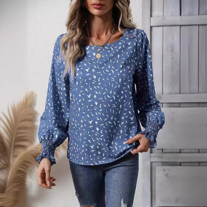 Kvinnor elegant blus med raffinerade puffärmar och en fin mönster Mirla-Eva Jonsson