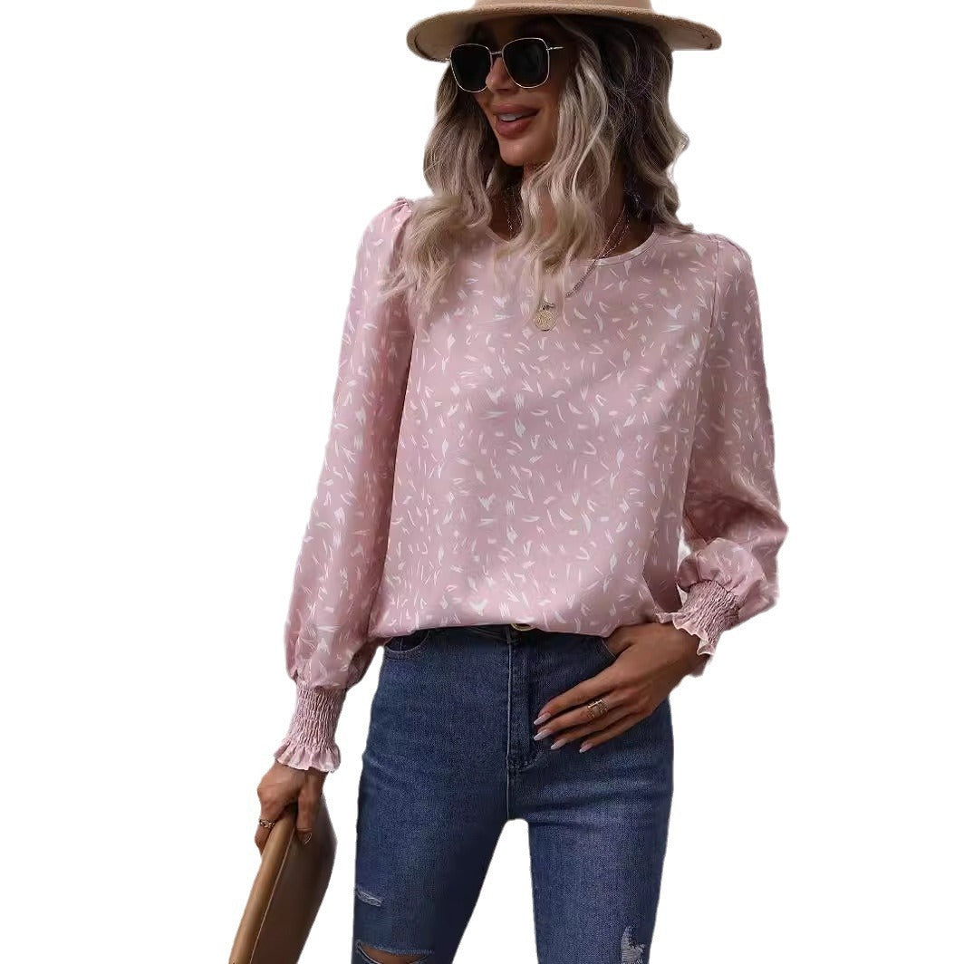 Kvinnor elegant blus med raffinerade puffärmar och en fin mönster Mirla-Eva Jonsson