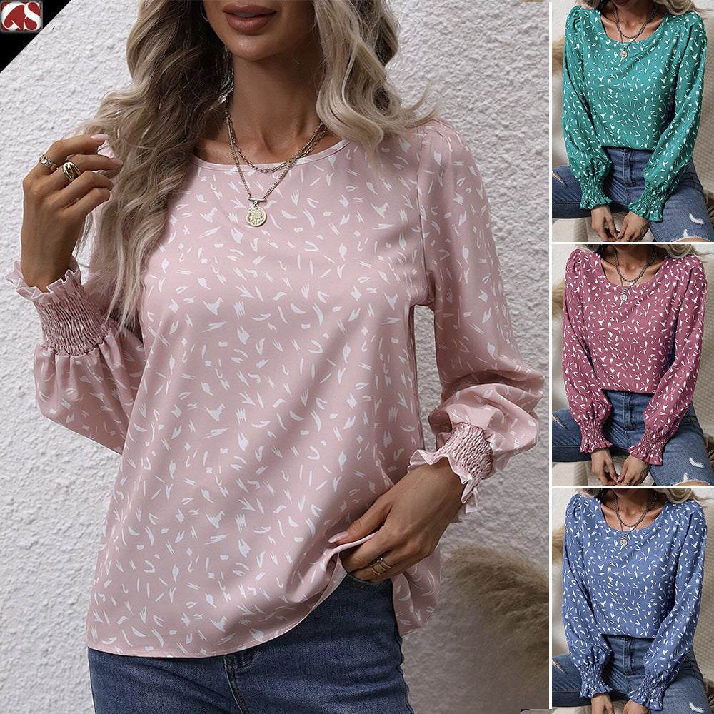 Kvinnor elegant blus med raffinerade puffärmar och en fin mönster Mirla-Eva Jonsson