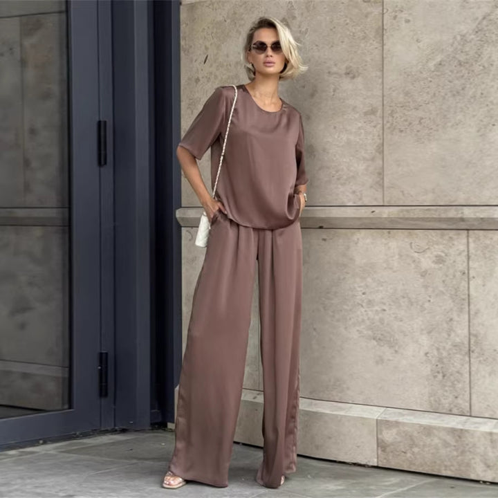 Kvinnor elegant och flödande tvådelat set med löst överdel och vida byxor Mirla-Eva Jonsson