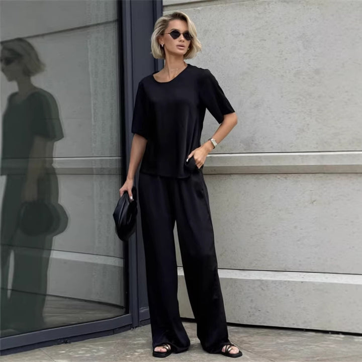 Kvinnor elegant och flödande tvådelat set med löst överdel och vida byxor Mirla-Eva Jonsson