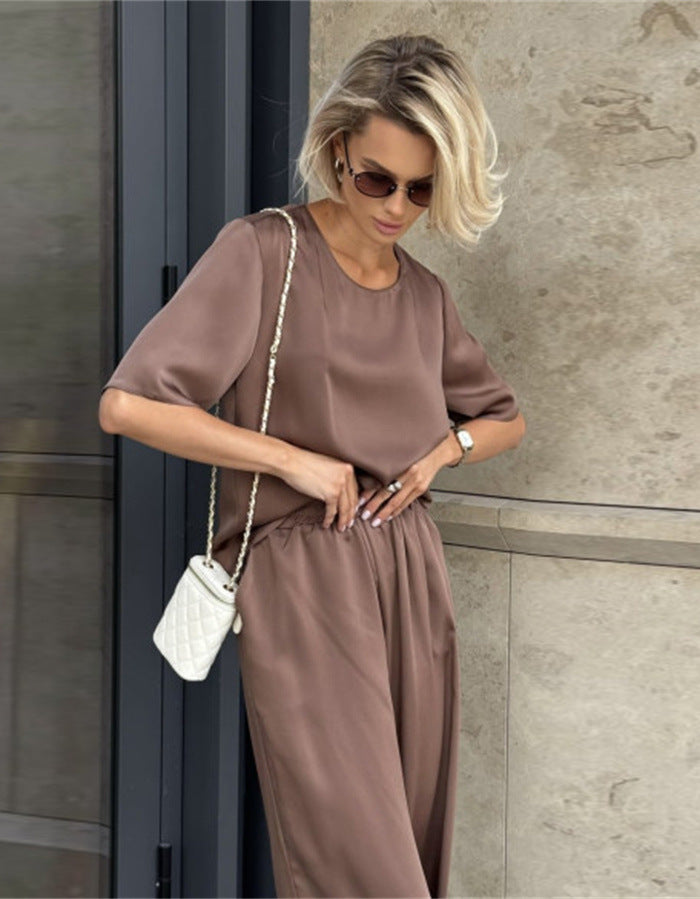 Kvinnor elegant och flödande tvådelat set med löst överdel och vida byxor Mirla-Eva Jonsson