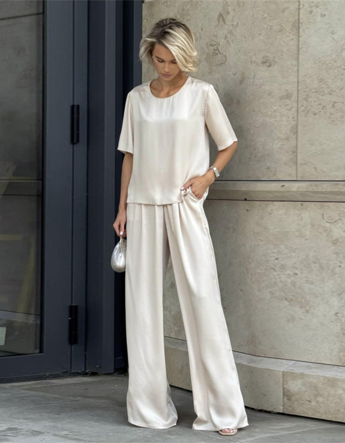 Kvinnor elegant och flödande tvådelat set med löst överdel och vida byxor Mirla-Eva Jonsson