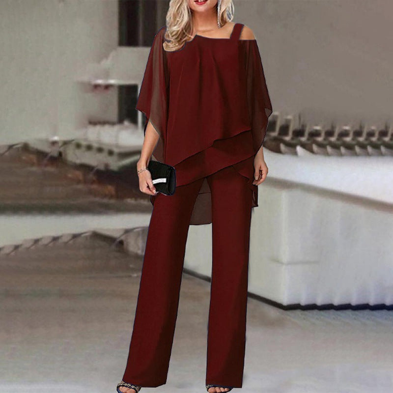 Kvinnor elegant tvådelat set med asymmetrisk topp och vida byxor Mirla-Eva Jonsson