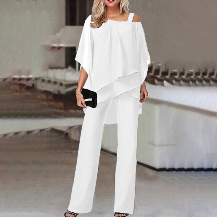 Kvinnor elegant tvådelat set med asymmetrisk topp och vida byxor Mirla-Eva Jonsson