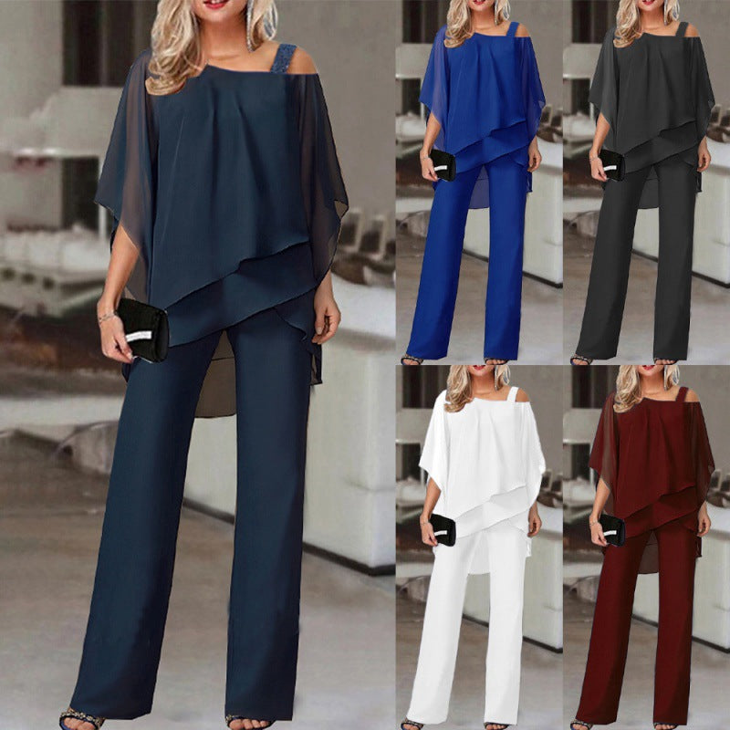 Kvinnor elegant tvådelat set med asymmetrisk topp och vida byxor Mirla-Eva Jonsson