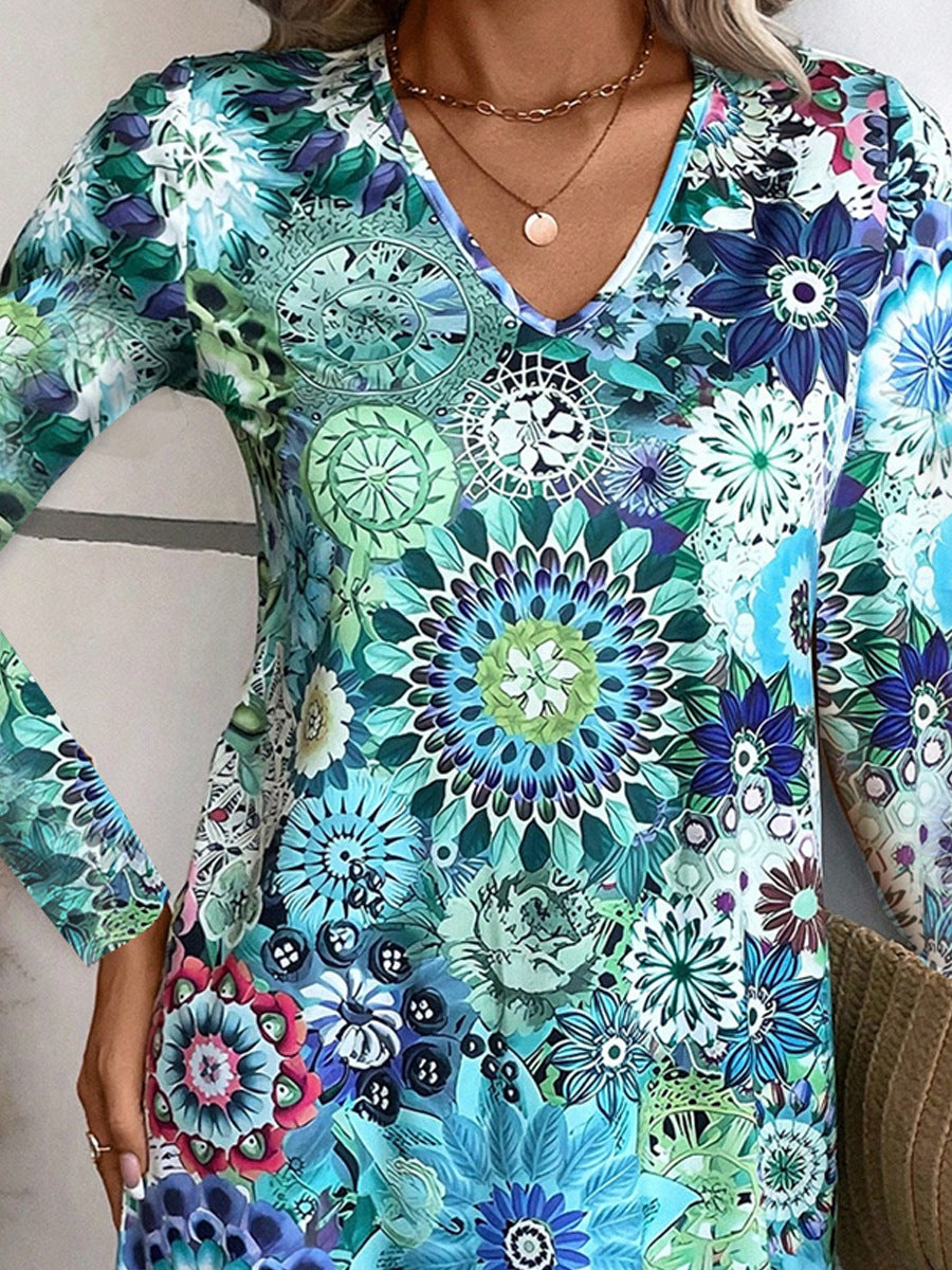 Kvinnor lekfull V-hals blusklänning med blommönster och långa ärmar Mirla-Eva Jonsson