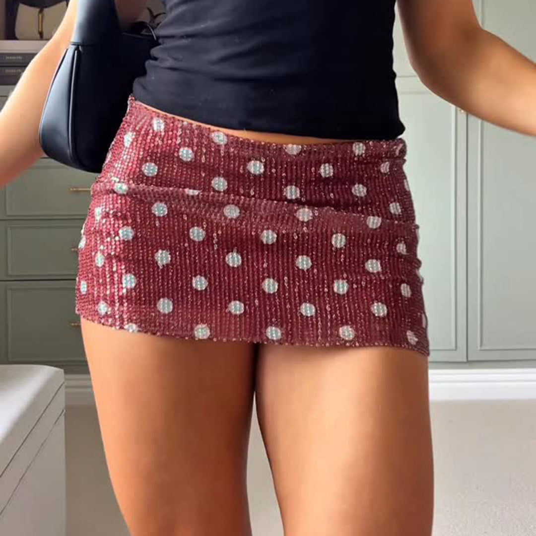 Kvinnor minikjol med glittrande polka-dot mönster och elastisk midja Mirla-Eva Jonsson