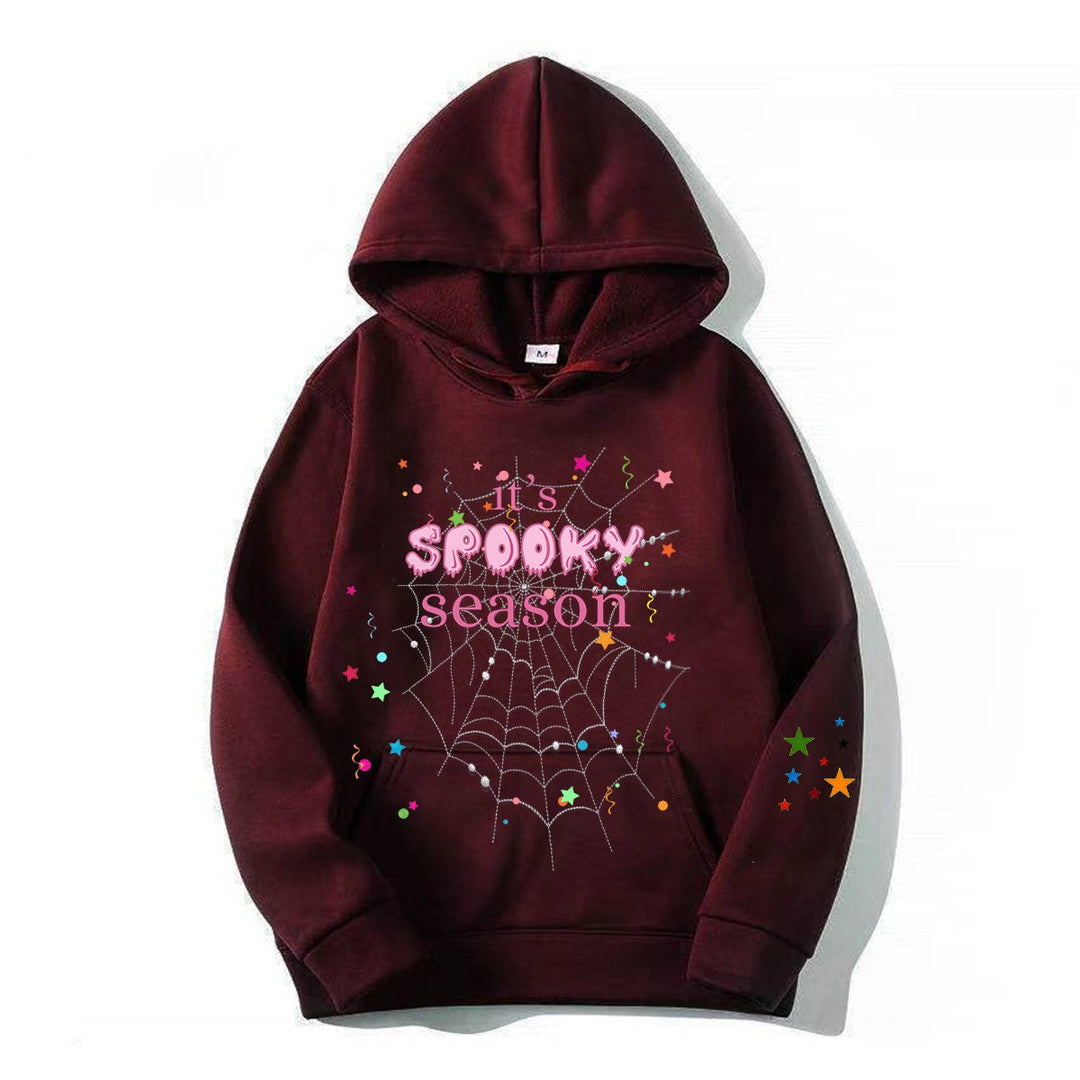 Kvinnor mysig hoodie med grafisk Halloween-design Mirla-Eva Jonsson