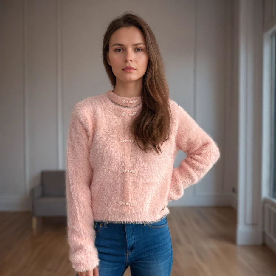 Kvinnor mysig tröja med hög krage och dekorativa knapppdetaljer Mirla-Eva Jonsson