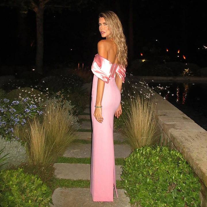 Kvinnor off-shoulder maxiklänning med elegant knytning och voluminösa puffärmar Mirla-Eva Jonsson