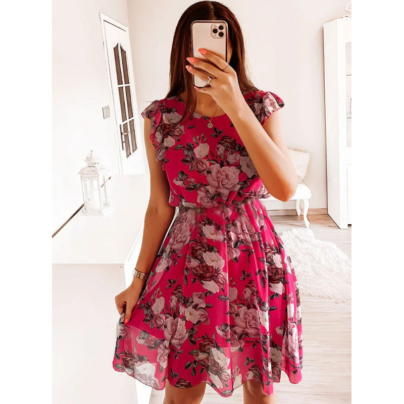 Kvinnor sommarklänning med blommönster, volangdetaljer och midjebälte Mirla-Eva Jonsson