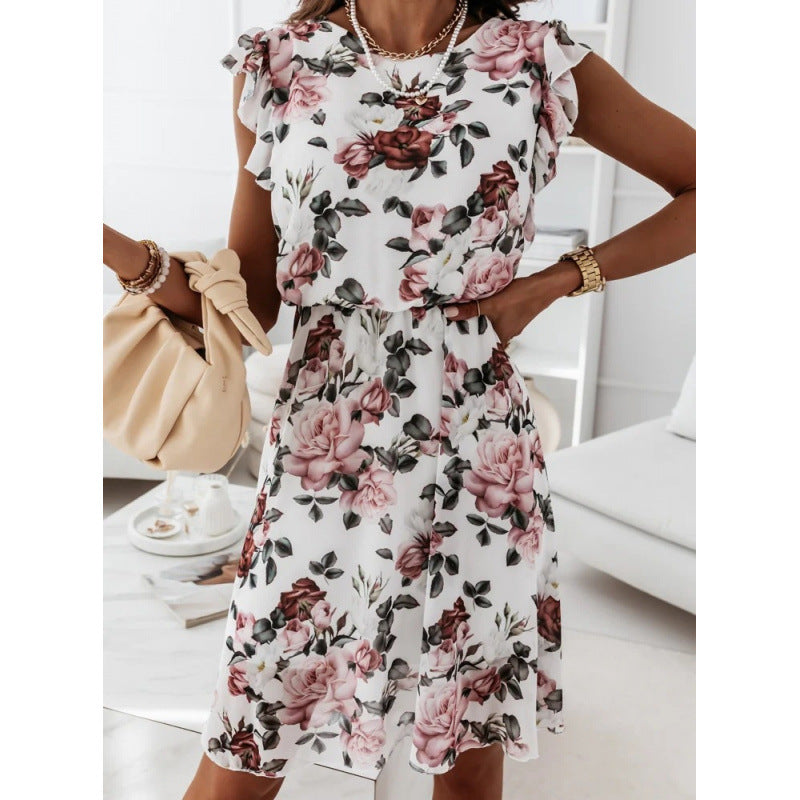 Kvinnor sommarklänning med blommönster, volangdetaljer och midjebälte Mirla-Eva Jonsson