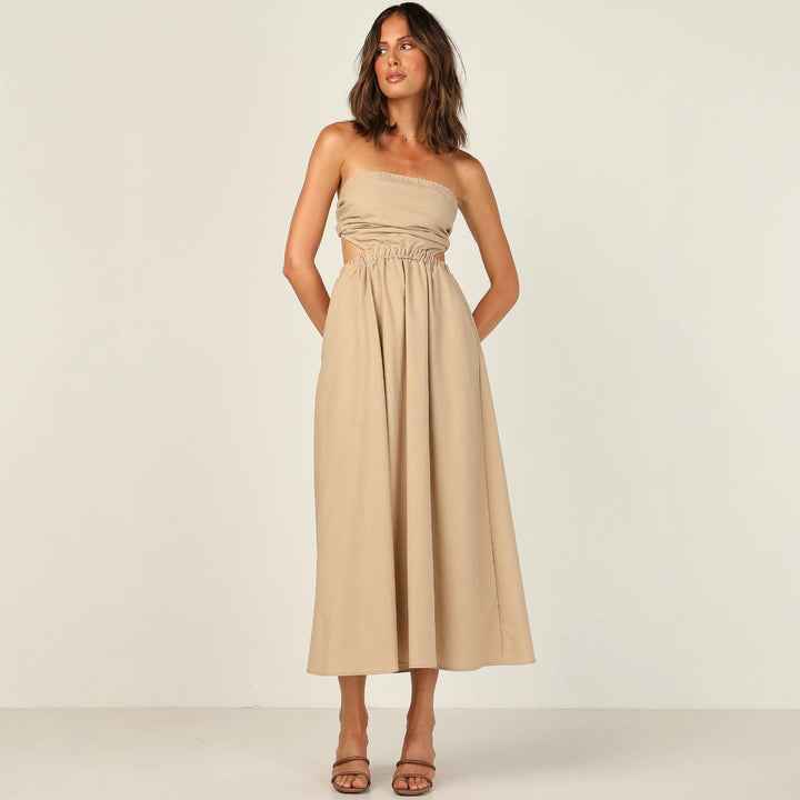 Kvinnor strapless maxi klänning med sidoklipp och praktisk fickdesign Mirla-Eva Jonsson