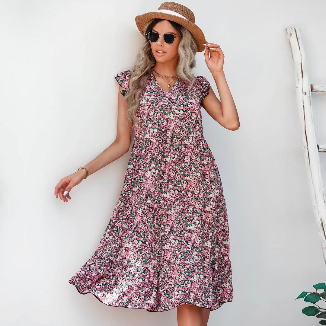 Kvinnors A-linjig klänning med voluminösa volangärmar och blommiga detaljer Mirla-Eva Jonsson
