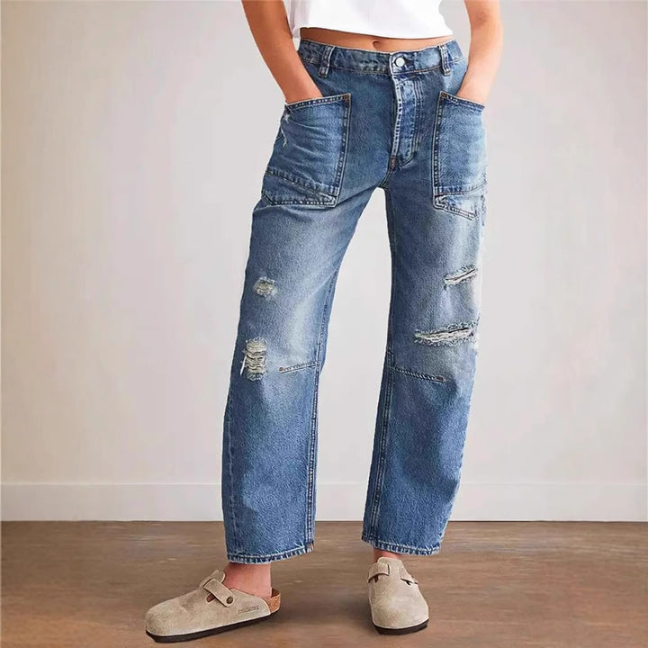 Kvinnors Baggy Jeans i Vintage Look med Förstörda Detaljer och Cargo Fickor Mirla-Eva Jonsson