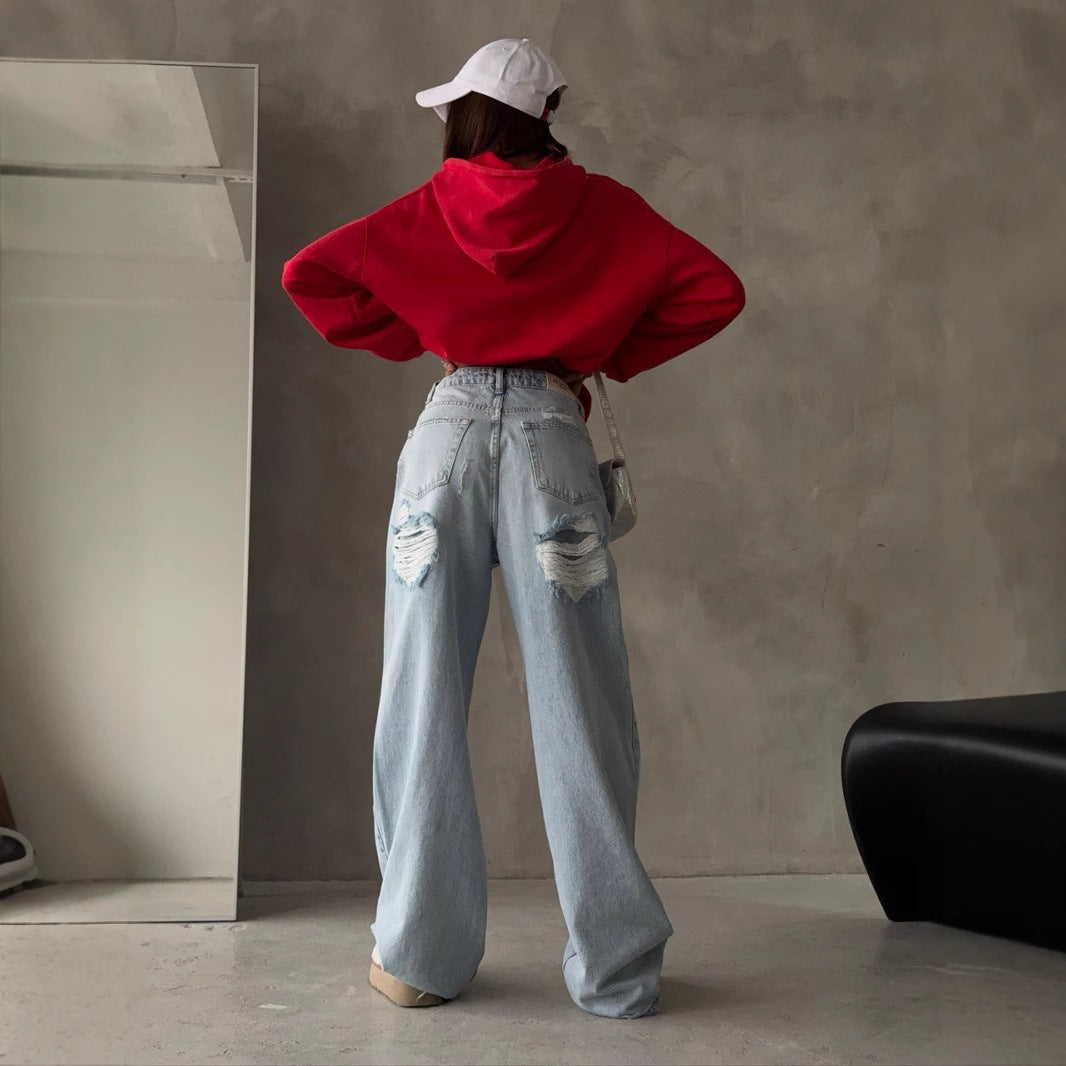 Kvinnors Baggy Jeans i Vintage Stil med Slitna Detaljer och Hög Midja Mirla-Eva Jonsson