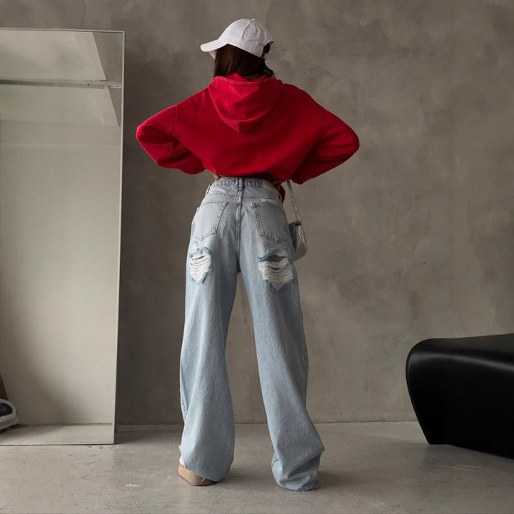 Kvinnors Baggy Jeans i Vintage Stil med Slitna Detaljer och Hög Midja Mirla-Eva Jonsson