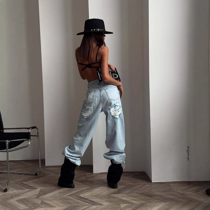 Kvinnors Baggy Jeans i Vintage Stil med Slitna Detaljer och Hög Midja Mirla-Eva Jonsson