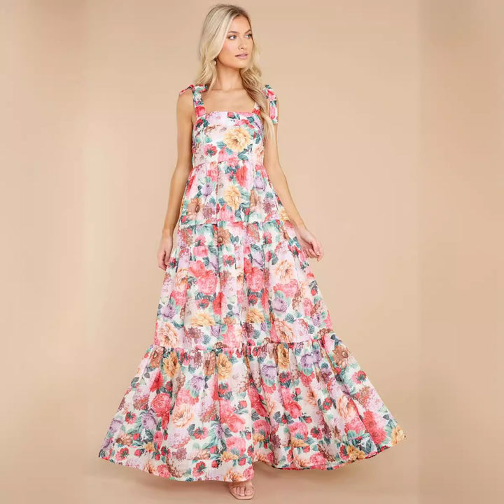 Kvinnors Boho Maxi Klänning med Lekfulla Volangdetaljer och Remmar Mirla-Eva Jonsson