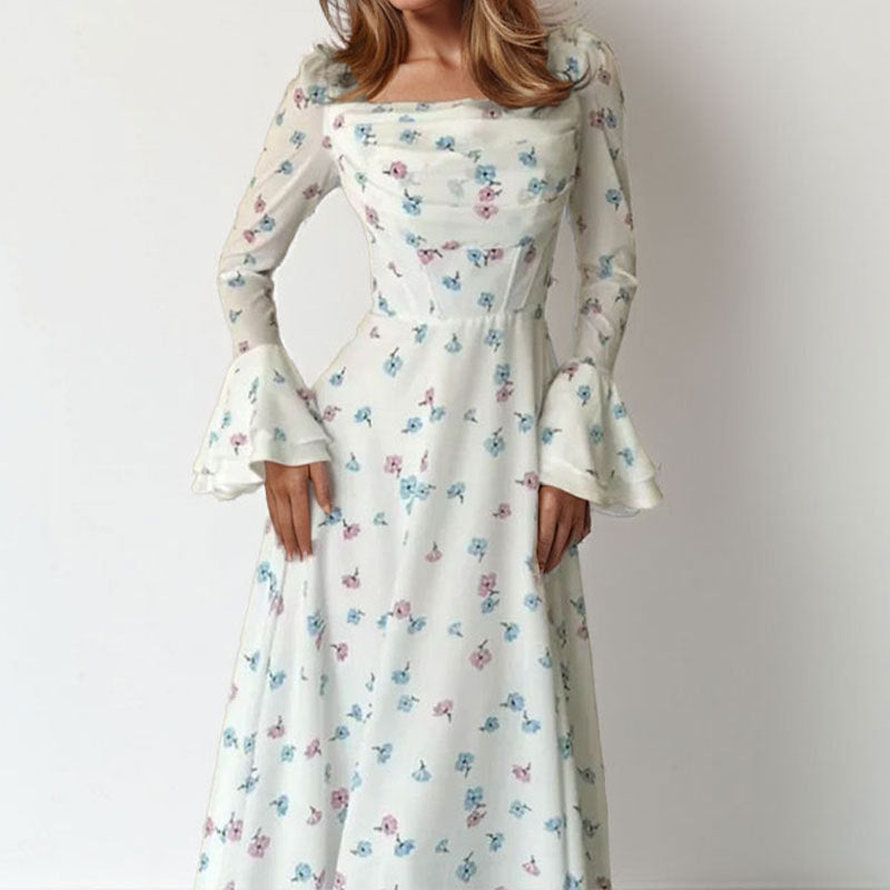 Kvinnors Elegant Maxi Klänning med Blommiga Applikationer och Voluminösa Ärmar Mirla-Eva Jonsson