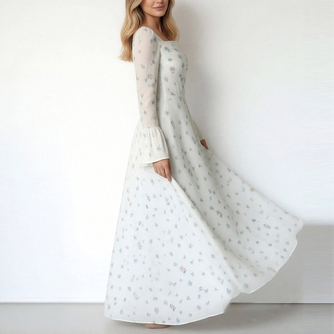 Kvinnors Elegant Maxi Klänning med Blommiga Applikationer och Voluminösa Ärmar Mirla-Eva Jonsson