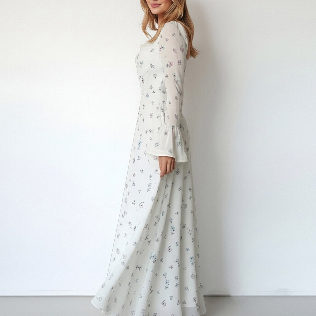 Kvinnors Elegant Maxi Klänning med Blommiga Applikationer och Voluminösa Ärmar Mirla-Eva Jonsson