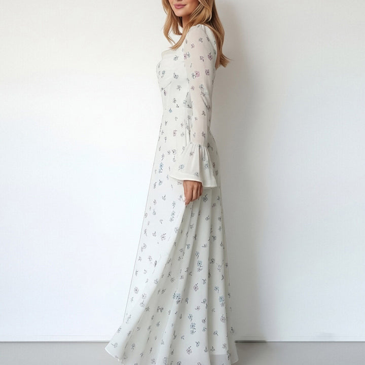 Kvinnors Elegant Maxi Klänning med Blommiga Applikationer och Voluminösa Ärmar Mirla-Eva Jonsson